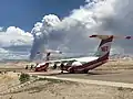 The fire seen from Grand Junction Regional Airport with airplanes used for aerial firefighting in foreground on August 3.