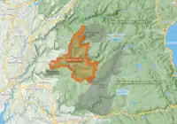 The footprint of the Mosquito Fire is shown in burnt orange, with a narrow end near Foresthill widening to the east as it spread into Tahoe and Eldorado National Forests. It butts up against the 2016 Trailhead Fire scar on its west side, the 2014 King Fire scar to its southeast side, and the 2013 American Fire scar on the northeast corner.