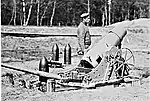 A 21 cm mortar with ammunition.