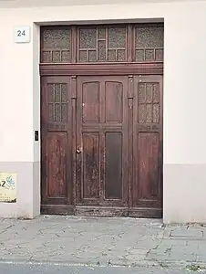 Adorned wooden door