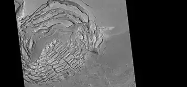 Large group of concentric cracks, as seen by HiRISE, under HiWish program Location is Ismenius Lacus quadrangle.  Cracks were formed by a volcano under ice.