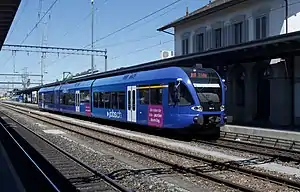 Blue train stopped at side platform