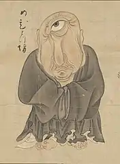 28 Mehitotsubō (めひとつ坊) means "Buddhist priest with one eye". Everything about his appearance is like a normal priest, except for the one eye in the middle of his face. He wears the black-and-white robes of a priest. He does not wear sandals, leaving his bare feet visible. His head is bald like a monk. He also has a long and ugly nose and face. His chin and face have black unshaven hairs growing, but they are not quite a beard or mustache. He also has one large eyebrow above his single eye.