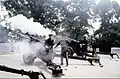 Members of the Presidential Salute Guns Battery,  3rd Infantry Regiment, render a gun salute with 3" anti-tank guns during a military funeral at Arlington National Cemetery on August 10, 1998.