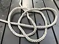 Step three of tying a Celtic Button knot end woven into loops