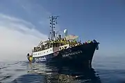 Sea-Watch 2 crowded with survivors who cover themselves in rescue blankets on 19 March 2017