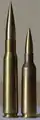 .50 BMG cartridge on the left and a .416 cartridge on the right.