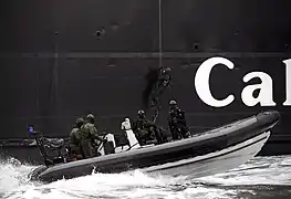 Pictured are Royal Marines from 43 Commando Fleet Protection Group, based at HMNB Clyde, conducting an ‘Underway Boarding Exercise’ in conjunction with a local Ferry, 2015.