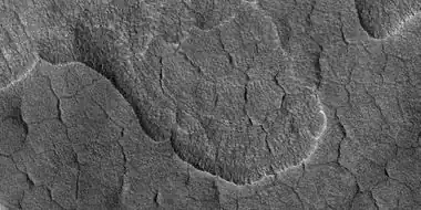 Scalloped terrain,  as seen by HiRISE under HiWish program The location is the Casius quadrangle. Studies suggest that there is water-ice in scalloped terrain.