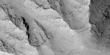 Close view of layers in the Louros Valles, as seen by HiRISE under HiWish program; this is an enlargement of a previous image.