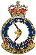 Crest of 4 Squadron, Royal Australian Air Force, featuring a fleur-de-lis on a boomerang and the motto "Cooperate to Strike"