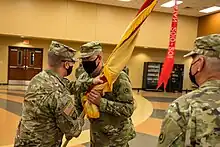 Passing the colors from one commander to another represents the passing of trust and well-being of the unit from one commander to another. Brig. Gen. John M. Dreska, commanding general, 311th Expeditionary Sustainment Command, passes the colors Col. David Nowicki during a change of command ceremony held on August 15, 2021.