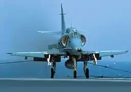 McDonnell Douglas AF-1 Skyhawk (A-4KU) from fighter squadron VF-1 Falcões catching the arrestor wire aboard São Paulo