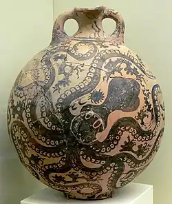 An ancient nearly spherical vase with 2 handles by the top, painted all over with an octopus decoration in black