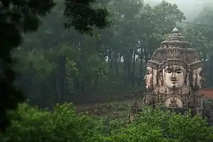 Brahma statue with various deities at Amarkantak.