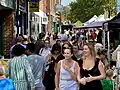 Shoppers browsing stalls on St Peter’s Street at St Albans Market.