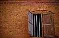 The red stone wall and a window