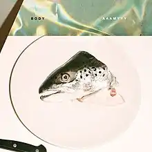 The head of a salmon fish in a circle.