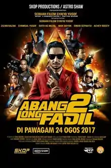 Official poster shows Abang Long Fadil as the titular character with the film's title, credits, and release date below.