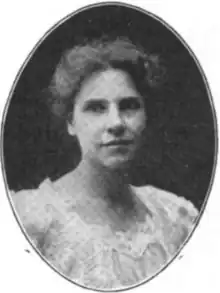 A white woman wearing a lacy blouse, in an oval frame