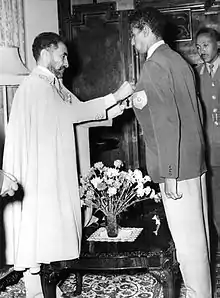 Haile Selassie awards the Star of Ethiopia to Abebe in the Green Salon of the emperor's palace.