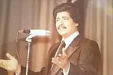 Photograph of Abu Bakr Salem while he is performing