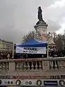 Station entrance and Monument à la République during the Nuit debout movement, 2016