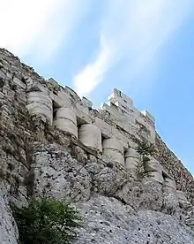 Column drums of the destroyed Older Parthenon, reused in building-up the North wall of the Acropolis, by Themistocles.