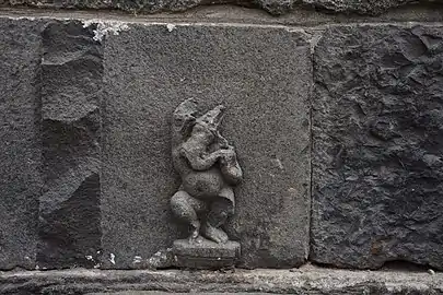 A Ganesha idol carving on the stone wall