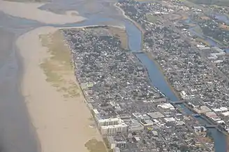 Aerial image of the river flowing south-to-north until turning west to the Pacific