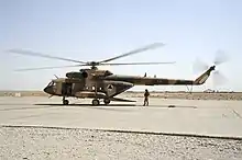 An Afghan Air Force Mi-17 helicopter sits on the ramp at Shindand Air Base in 2011.