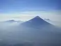 Volcán de Agua exhibits the steep cone shape typical of stratovolcanoes; as seen from Acatenango's Pico Mayor.