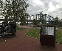 Colour picture of memorial with the bridge in the background