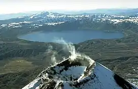 The lake-filled Akademia Nauk caldera, seen here from the north with Karymsky volcano in the foreground.