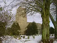 All Saints Church viewed from The Street in winter.