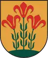 A coat of arms depicting three flowers that have red petals, green stalks, and green leaves all sprouting from green earth