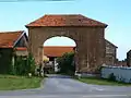 Entrance gate to the farm next to the church