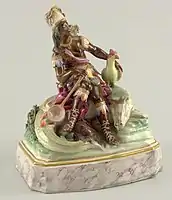 Spanish porcelain figure, c. 1770, with attributes including a severed head and alligator