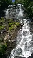 Main cascade - view looking up from hiking trail foot bridge