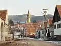 Main street of Amnaș village with the Saxon fortified church in the background