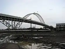 An Amtrak train passing beneath the Fremont Bridge