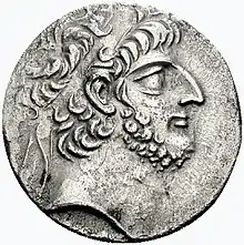 Coin with the bust of a hawk-nosed, bearded, curly-haired man wearing a diadem