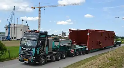 Volvo tractor with drop deck configuration moving oversize load