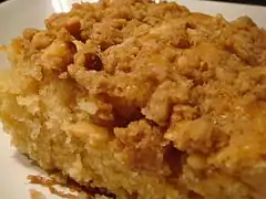 Applesauce coffee cake garnished with walnuts