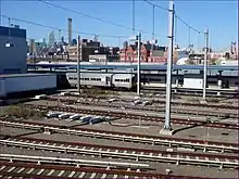 The Arch Street Maintenance Yard and Shop, a short gray and blue building with maintenance tracks running into the building from the right side