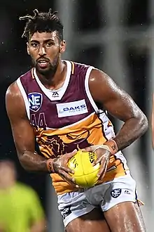 Archie Smith in 2019 as 6 ft 8 in (202 cm)  Brisbane Lions ruck is the son of NBA basketball player Andre Moore