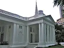 Tuscan Doric porticos capped with triangular pediments feature on the south front of the church.