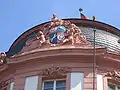 Coat of arms of the Ostein dynasty, framing the central risalit on the facade