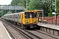 A Merseyrail Class 508 arrives with a service.