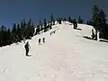 Ascending Mt. Judah from the col with Donner Peak